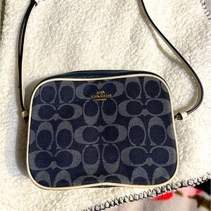 Authentic Coach crossbody purse signature chambray , white leather trimming.